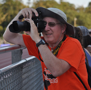 Scott Durham capturing runners running by during a track meet.