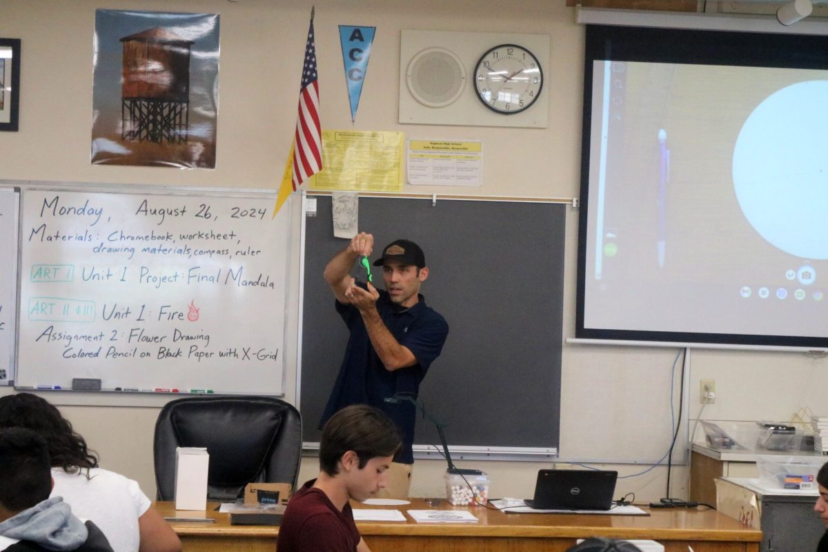 Nicholas Brown instructing  an art course at Hughson High School. 